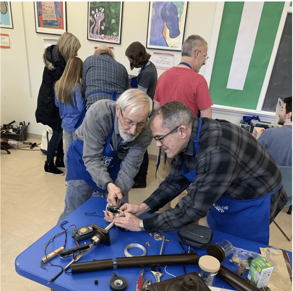 Charlie Tyler and Jim McLauren fix a dimmer switch lamp