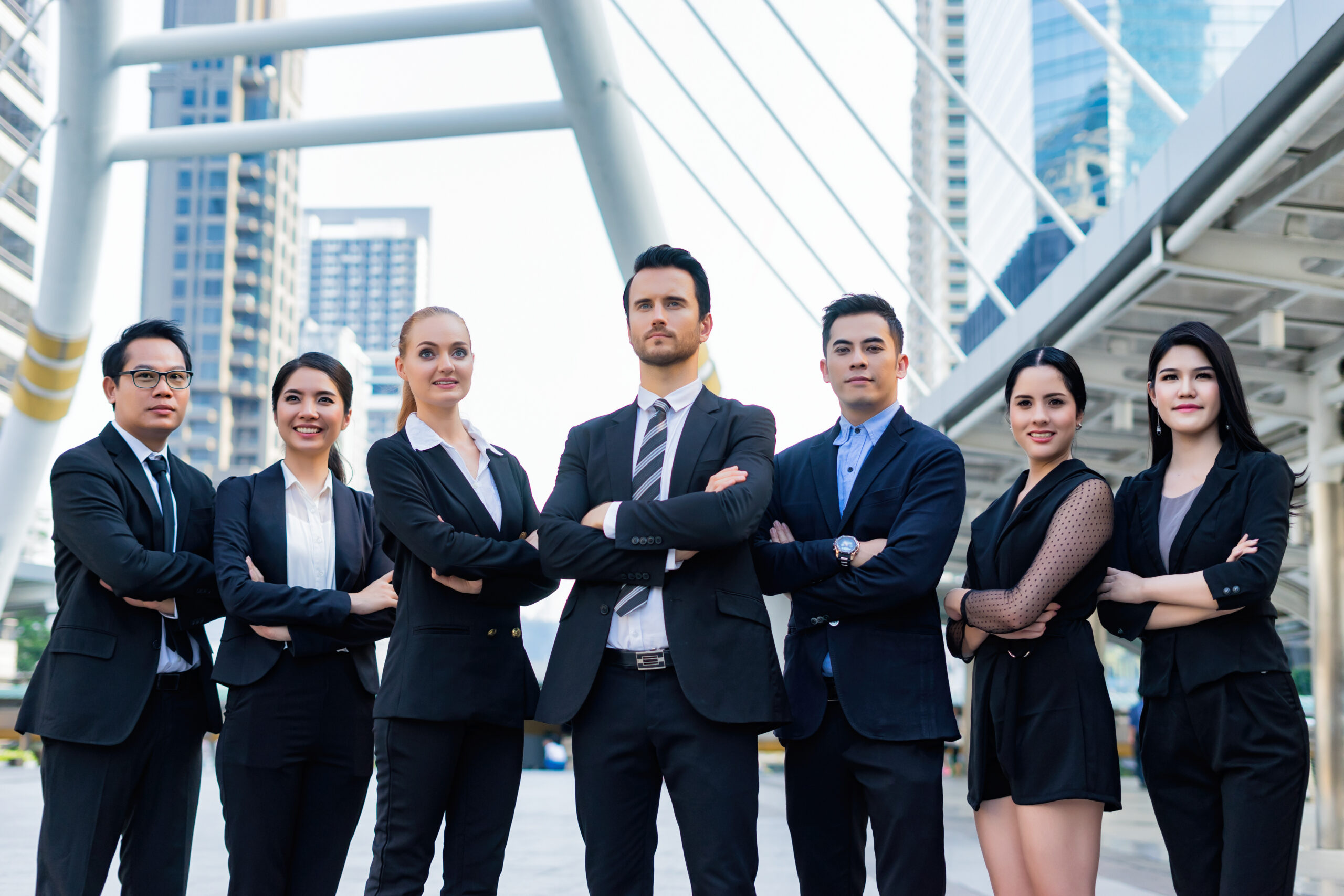 Multiethnic Diverse Business group Posing on arms,Friendly busin Multiethnic Diverse Business group Posing on arms,Friendly busin